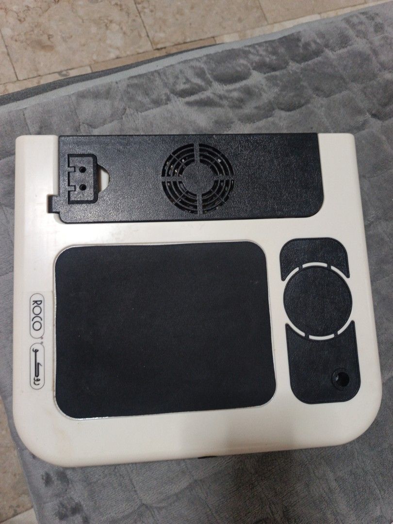 Laptop Desk Cooler (Category: Laptops & Notebooks) located in Manila. Submitted by zedddyxo (Listing ID 1456488283, Image 3). Description: - Brand: Roco - Type: Laptop Desk Cooler - Features: Dual built-in cooling fans - Design: Foldable for easy storage and transport - Built in mousepad - Adjustable legs for height - Functionality: Helps prevent laptop overheating - Condition: Used, good working condition - Meetup Location: Las Piñas City.