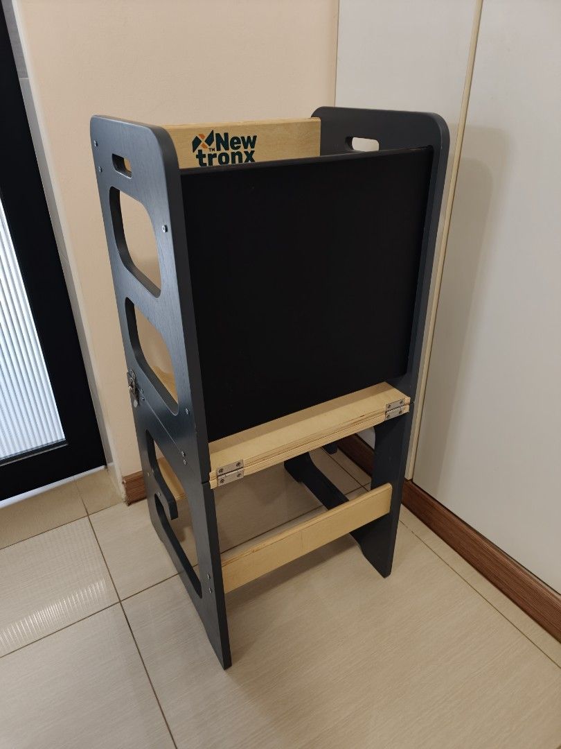 Learning Tower (Category: Other Kids Furniture) located in Singapore. Submitted by movinghousedec (Listing ID 1456540713, Image 1). Description: - NewtronX 4-in-1 Learning Tower - Navy colour, slightly scratched (image 4) - Chalkboard - Convert to desk and chair / use as step stool - Very rarely use, hence selling .