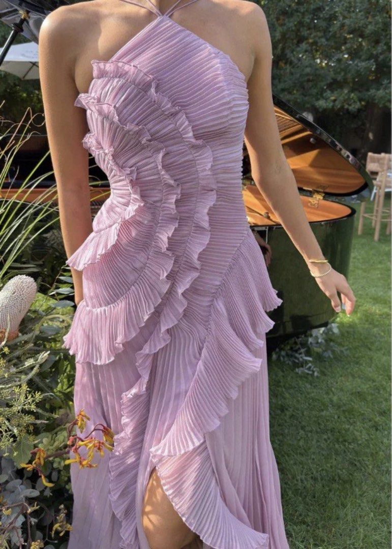 Lilac Pleated Halter Neck Ruffle Dress (Category: Dresses) located in Makati City. Submitted by andiquality (Listing ID 1456539309, Image 2). Description: - Gorgeous lilac halter neck dress - Features intricate pleating and cascading ruffles down the front - Modern asymmetrical hemline - Fabric has a lovely flow - Ideal for special occasions or formal events - XS - Bust 80cm; (laid flat naturally) up to 86cm (laid flat stretched) Waist 60cm; (lai