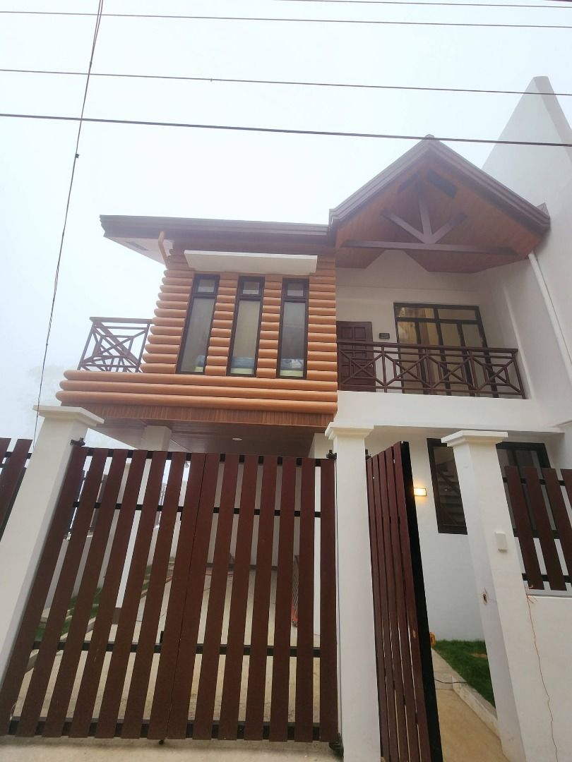 Log home inspired house 2 storey duplex type (Category: House & Lot) located in Baguio. Submitted by baguio.joshuatreerealty (Listing ID 1456466872, Image 1). Description: Log home inspired house 2 storey duplex type Brand new Lot area: 96sqm. Floor area: 160sqm. Location: Tuba Marcos highway G/F: Living room, dining room, kitchen, common bedrooms, common toilet and bath, dirty kitchen, laundry area, garden 2/F: Master's bedroom with own toilet a