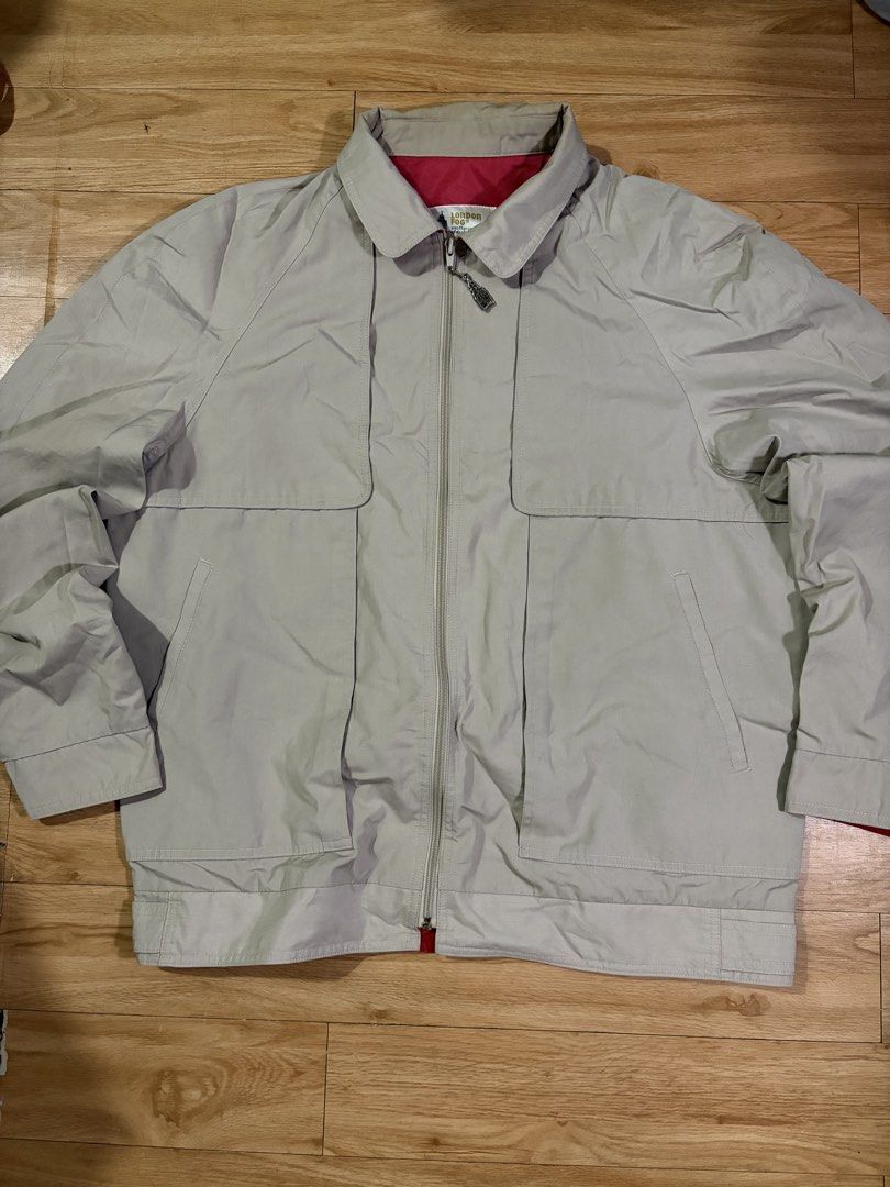 London Fog Beige Harrington Jacket (Category: Coats, Jackets and Outerwear) located in Paranaque City. Submitted by uw4kk (Listing ID 1456556574, Image 1). Description: - Missing clip and it has a minor flaw on the neck - Classic London Fog jacket - Beige color with red lining - Zip-up front - Two front pockets - Size: 44 REG - Made in Taiwan - Ideal for cooler weather.