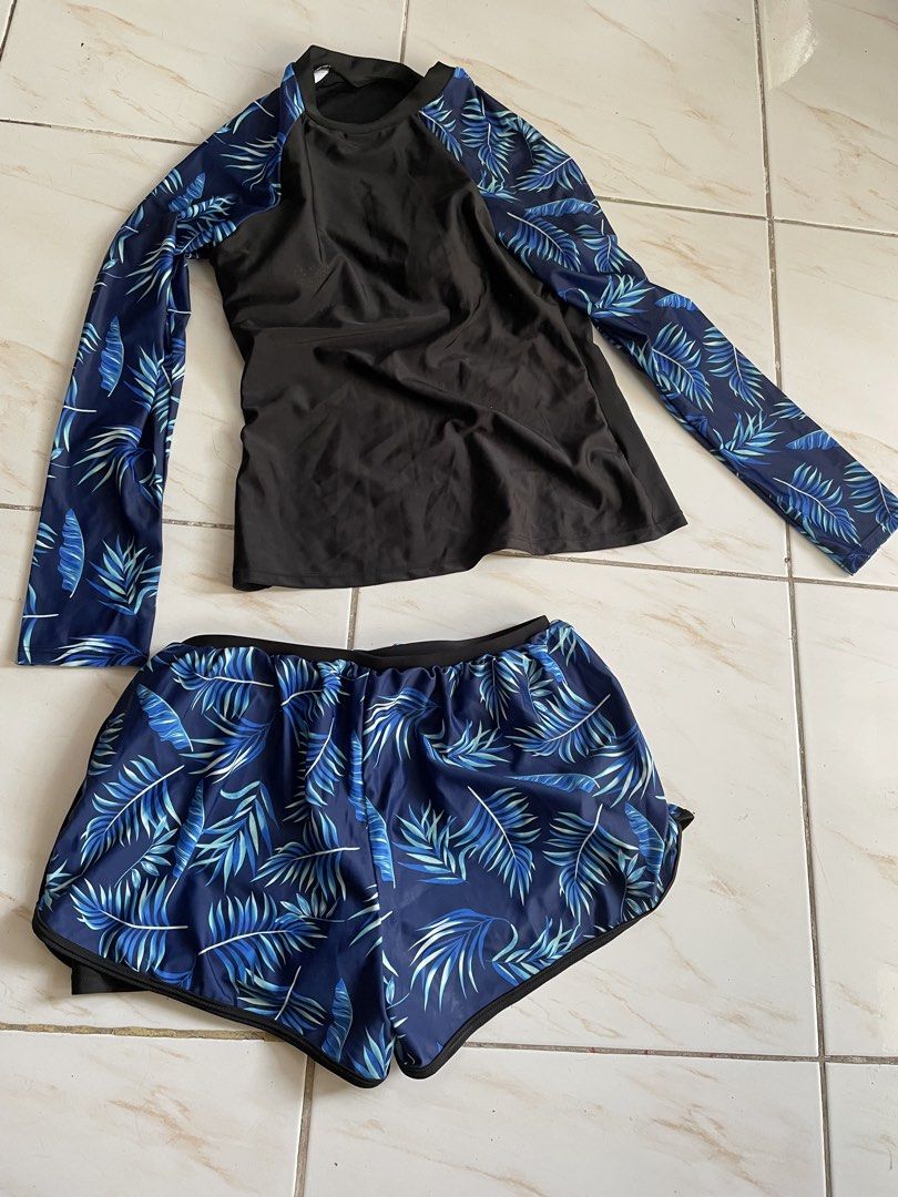 Long Sleeve Rash Guard and Shorts Set - Leaf Print (Category: Rash guard) located in Pasig City. Submitted by khaleisi (Listing ID 1456438259, Image 1). Description: - Padded Black long sleeve rash guard - Blue and green leaf print on sleeves - Matching blue and green leaf print shorts with black short inside - Ideal for swimming and sun protection - Comfortable fit - Perfect for beach trips or pool days - Bust 30-34” length 22” - Shorts waist 28