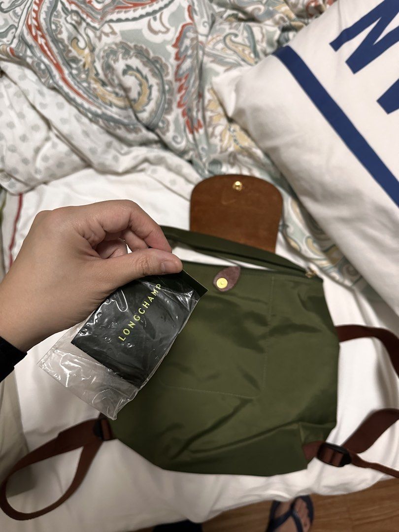 Longchamp Le Pliage Backpack (Category: Luxury Bags & Wallets) located in Quezon City. Submitted by candice_kua (Listing ID 1456545027, Image 2). Description: Barely used backpack .