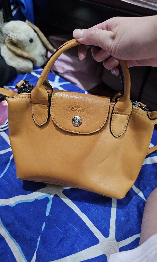 Longchamp Mini Bag (Category: Luxury Bags & Wallets) located in Quezon City. Submitted by Ley97 (Listing ID 1456544171, Image 2). Description: •leather scratches.