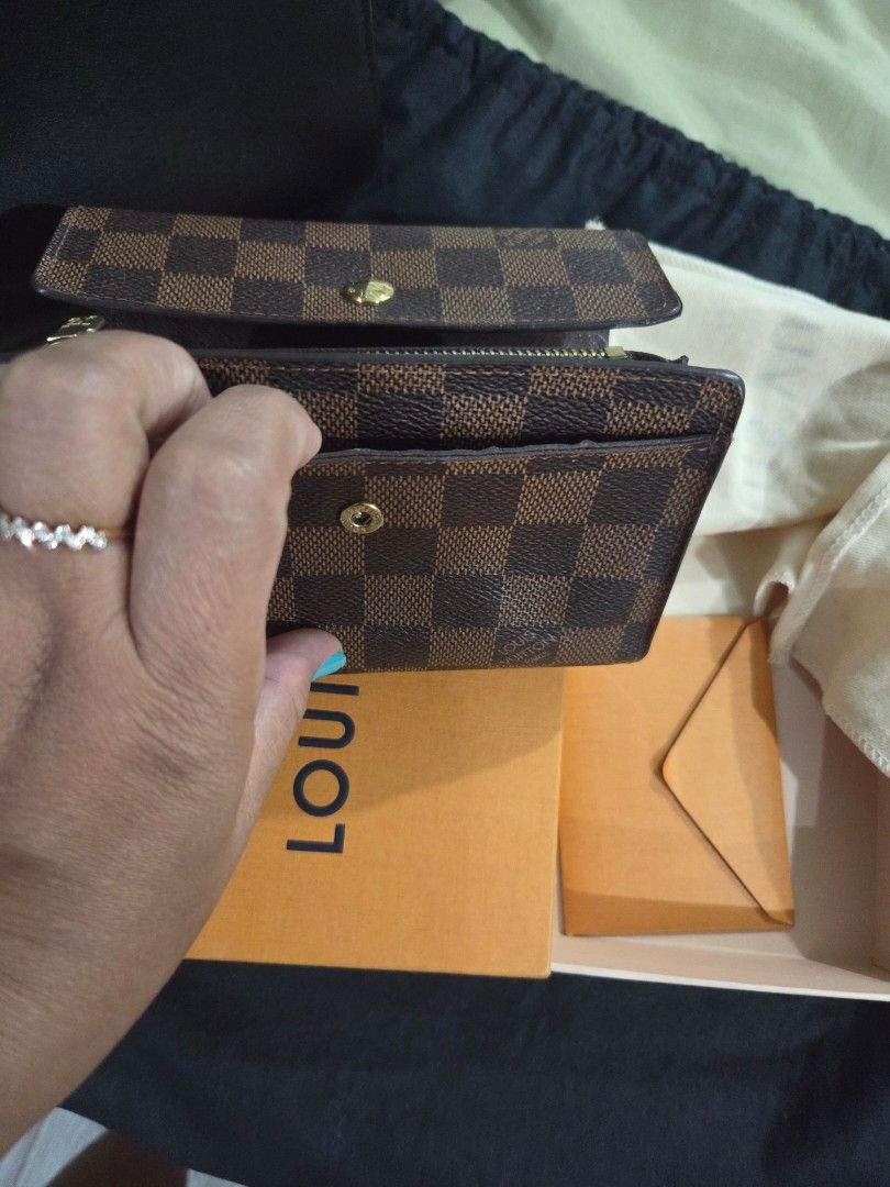 Louis Vuitton Damier Azur Small Wallet (Category: Luxury Bags & Wallets) located in Davao. Submitted by gretchenal19856 (Listing ID 1456474749, Image 3). Description: - Authentic Louis Vuitton wallet in Damier Azur canvas - Secure snap button closure - Convenient zipped coin compartment - Ample card slots for organization - Comes with original box, dust bag, and shopping bag - Ideal for everyday essentials.