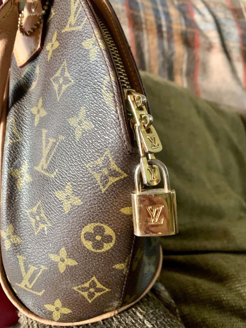 Louis Vuitton Monogram Canvas Handbag (Category: Luxury Bags & Wallets) located in Manila. Submitted by christalyn94263 (Listing ID 1456572498, Image 2). Description: - Classic Louis Vuitton monogram canvas handbag - Genuine leather trim and handles - Secure zipper closure with original lock and key - Iconic dome shape with convenient front pocket - A timeless addition to any collection - Please note: Shows some signs of wear on the handles and l