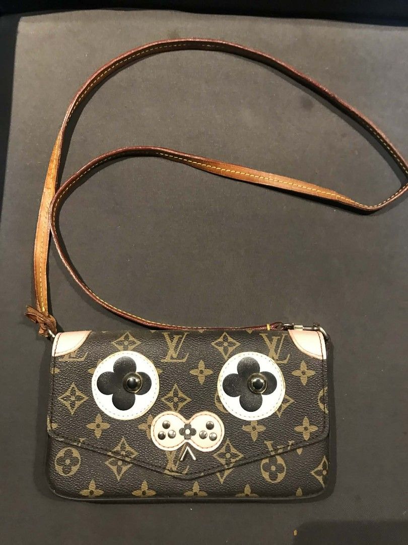 Louis Vuitton Monogram Mini Pochette Accessoire Piggy Face (Category: Luxury Bags & Wallets) located in Midsayap. Submitted by purse_gedo (Listing ID 1456599026, Image 1). Description: - Cute Louis Vuitton crossbody bag - Monogram canvas with playful piggy face design - Pink interior - Adjustable leather strap - Ideal for essentials - Shows some wear on strap and corners - Perfect for a fun, playful look.