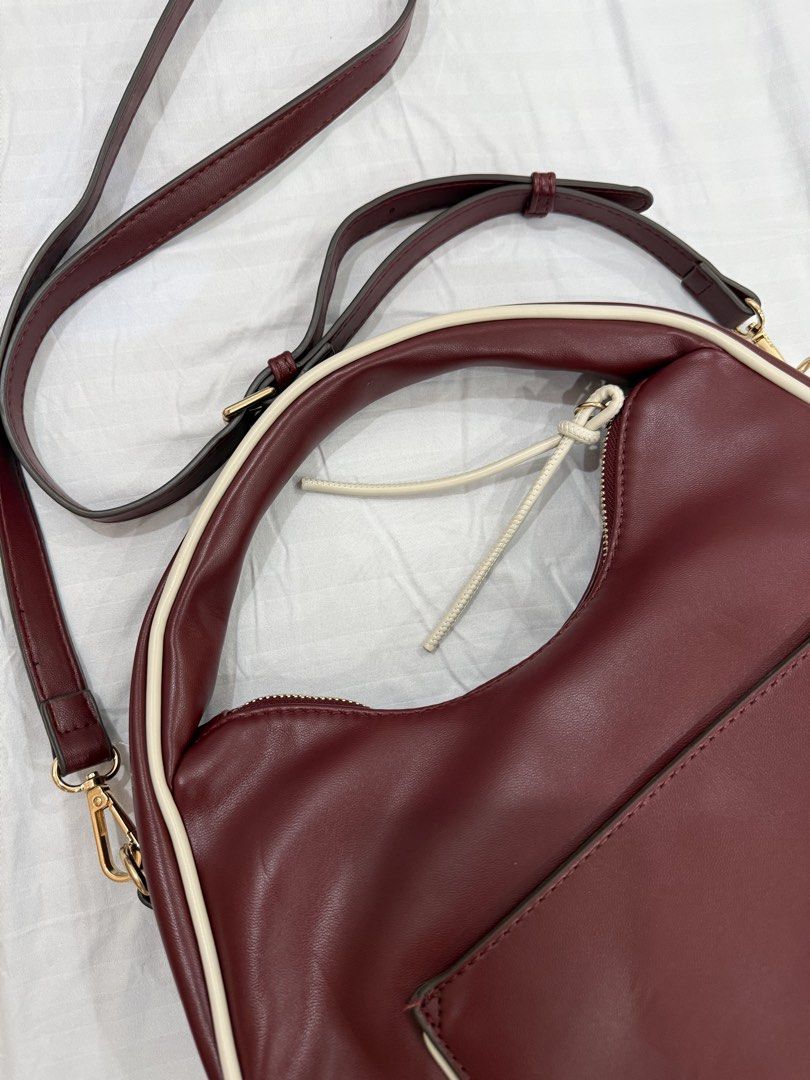 Mali + Lili shoulder with crossbody strap bag (Category: Cross-body Bags) located in Bulacan. Submitted by kallyseconds (Listing ID 1456435429, Image 2). Description: Softly structured silhouette designed for effortless everyday style Adjustable strap allows shoulder carry or hands-free crossbody wear Secure zip-top closure with convenient back slip pocket 12” L x 3” W x 9” H with 6.5” top handle drop for comfortable carry.