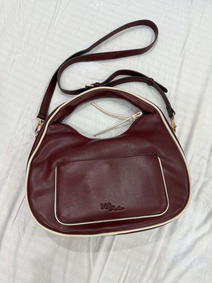 Mali + Lili shoulder with crossbody strap bag (Category: Cross-body Bags) located in Bulacan. Submitted by kallyseconds (Listing ID 1456435429, Image 1). Description: Softly structured silhouette designed for effortless everyday style Adjustable strap allows shoulder carry or hands-free crossbody wear Secure zip-top closure with convenient back slip pocket 12” L x 3” W x 9” H with 6.5” top handle drop for comfortable carry.