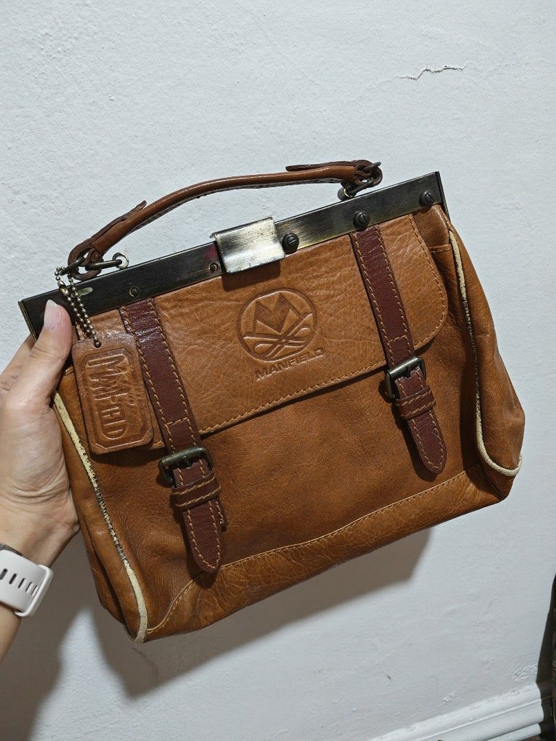 Manfield Vintage Bag (Category: Luxury Bags & Wallets) located in Quezon City. Submitted by theclutteredapt. (Listing ID 1456471872, Image 2). Description: Manfield Vintage Bag - Missing screws in design - Leather worn out - Scratches.