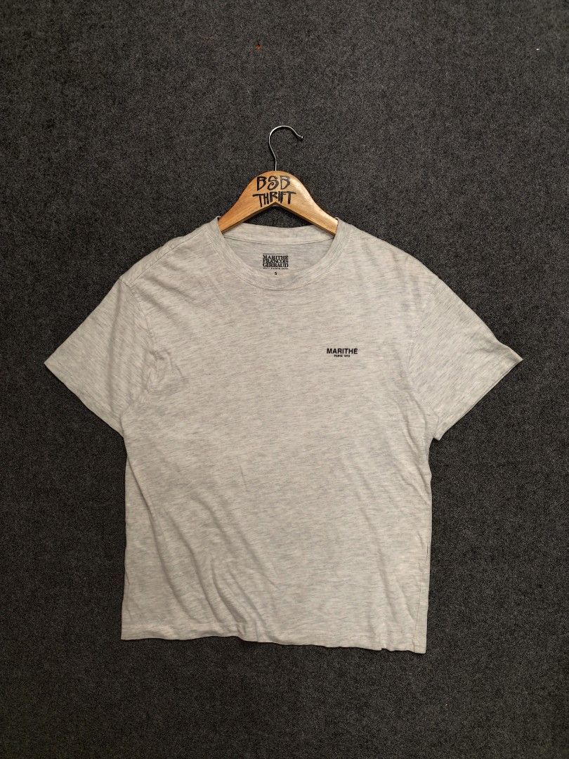 MARITHE FRANCOIS GIRBAUD Paris 1972 Grey T-Shirt Size S (Category: Shirts) located in Cordova. Submitted by bsb.streetluxvintage.clothing (Listing ID 1456573575, Image 1). Description: - Grey Marithe Francois Girbaud T-Shirt - Features 'Marithe Paris 1972' logo on chest - Size: S (Tag) - Measurements: Approx. 18" pit to pit, 25" length - Material: 100% Cotton - Ideal for casual, everyday wear.