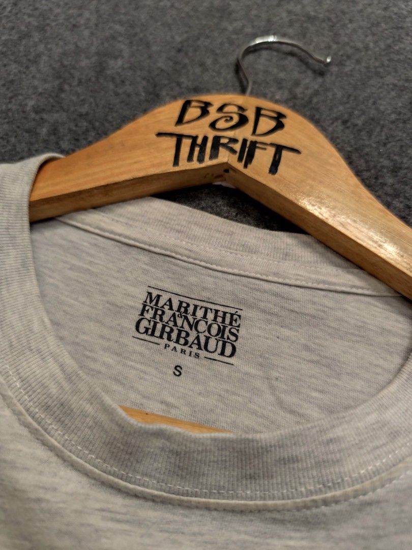 MARITHE FRANCOIS GIRBAUD Paris 1972 Grey T-Shirt Size S (Category: Shirts) located in Cordova. Submitted by bsb.streetluxvintage.clothing (Listing ID 1456573575, Image 3). Description: - Grey Marithe Francois Girbaud T-Shirt - Features 'Marithe Paris 1972' logo on chest - Size: S (Tag) - Measurements: Approx. 18" pit to pit, 25" length - Material: 100% Cotton - Ideal for casual, everyday wear.