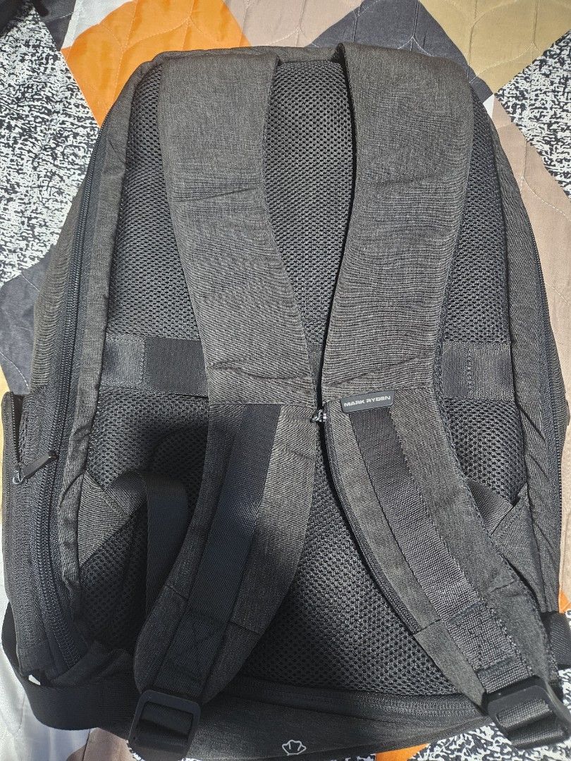 Mark Ryden Anti-Theft Backpack with TSA Lock (Category: Backpacks) located in Manila. Submitted by mistyricst08057 (Listing ID 1456524815, Image 2). Description: - Dark grey Mark Ryden backpack - Built-in TSA lock for enhanced security - Ample storage with multiple compartments - Comfortable padded shoulder straps - Ideal for travel and daily commutes - Smooth, reliable zippers - Overall clean and well-maintained appearance.