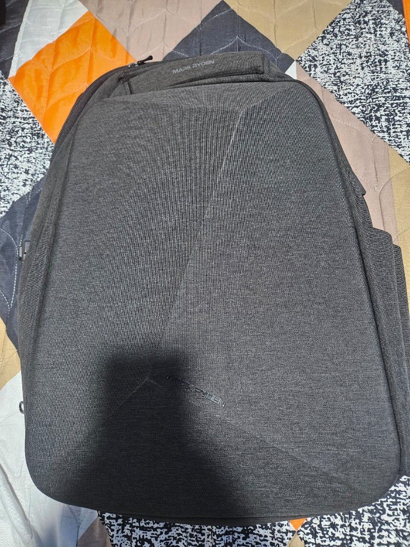 Mark Ryden Anti-Theft Backpack with TSA Lock (Category: Backpacks) located in Manila. Submitted by mistyricst08057 (Listing ID 1456524815, Image 3). Description: - Dark grey Mark Ryden backpack - Built-in TSA lock for enhanced security - Ample storage with multiple compartments - Comfortable padded shoulder straps - Ideal for travel and daily commutes - Smooth, reliable zippers - Overall clean and well-maintained appearance.