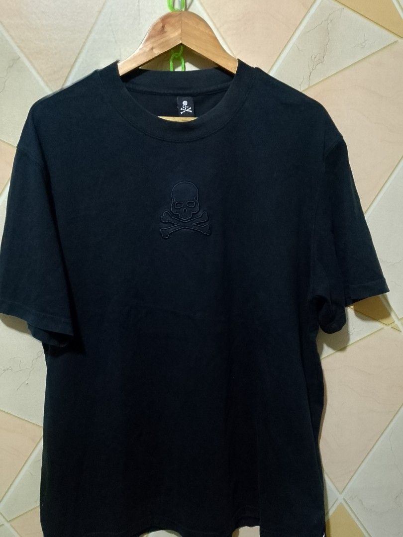 Mastermind Japan Skull T-Shirt Black (Category: Tshirts & Polo Shirts ) located in San Pedro. Submitted by jokwanrocks09 (Listing ID 1456537796, Image 2). Description: - Authentic Mastermind Japan black t-shirt. - Iconic embroidered skull and crossbones logo on the front. - 'MASTERMIND' text embroidered on the back. - Unique metal ring detail near the collar. - Made with good quality fabric for comfort and durability. - A must-have classic piece 