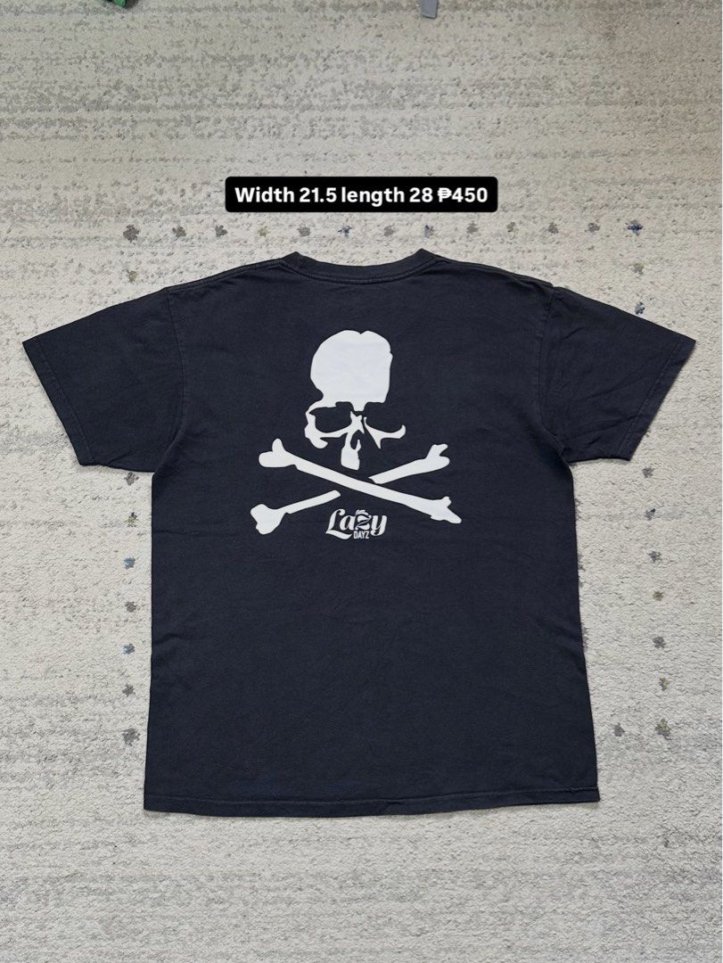 Mastermind World T-Shirt Skull Crossbones Logo Black (Category: Tshirts & Polo Shirts ) located in Daet. Submitted by thrifthings2018 (Listing ID 1456482295, Image 1). Description: - Authentic Mastermind World t-shirt - Features the iconic 'Never Give Up' slogan on the front - Includes skull and crossbones graphics - 'Lazy Boy' text and large skull graphic on the back - Measurements: 21.5 inches width, 28 inches length - Price: P450.