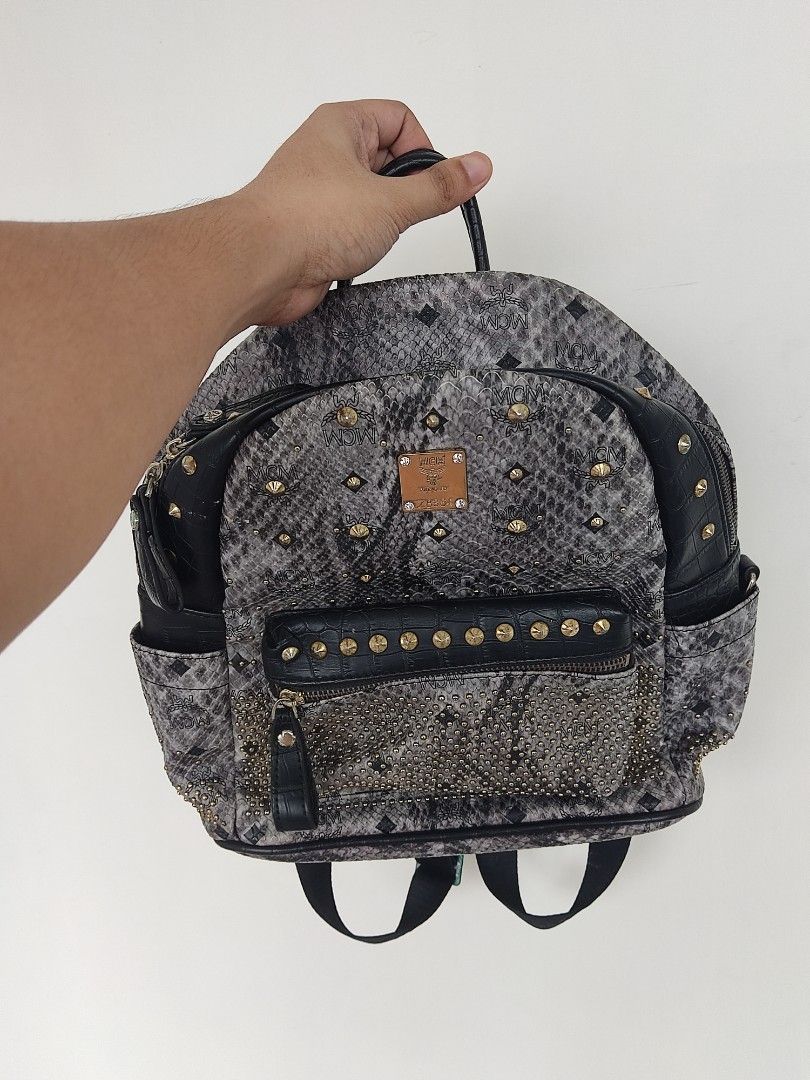 MCM Studded Snakeskin Backpack (Category: Luxury Bags & Wallets) located in Pasig City. Submitted by vintage.thrifttph (Listing ID 1456513130, Image 1). Description: dm if interested thanks, more items on profile to check. Pickup: 📌 Kapasigan, Pasig Shipping via: 🚛 Lalamove / JNT.