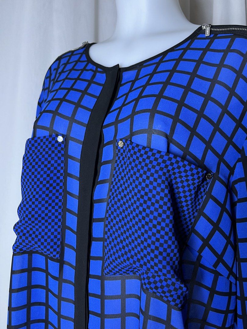 Michael Kors 2X Blue and Black Button-Up Shirt (Category: Blouses) located in Bulacan. Submitted by stacksonracks_ph (Listing ID 1456446277, Image 2). Description: - Michael Kors button-up shirt - All-over black and blue geometric print - Two chest pockets - Perfect for dressing up or down.