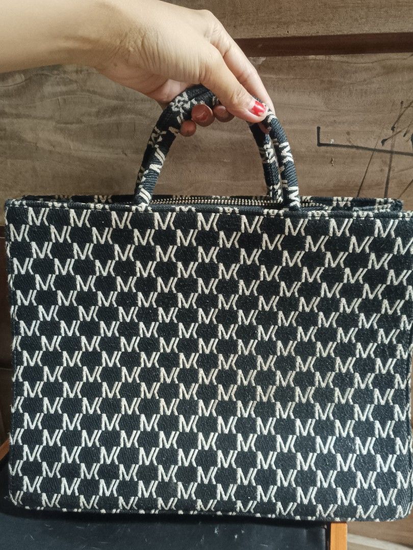 MIOCRA KOLY Tote Bag with CHRISTIAN DIOR Strap (Category: Luxury Bags & Wallets) located in Cebu City. Submitted by elen30abalo (Listing ID 1456425749, Image 3). Description: - Stylish black and white patterned tote bag - 'MIOCRA KOLY' text detail on the exterior - Interior strap with 'CHRISTIAN DIOR' text - Secure zipper closure - Ample space for everyday essentials - Ideal for daily use.