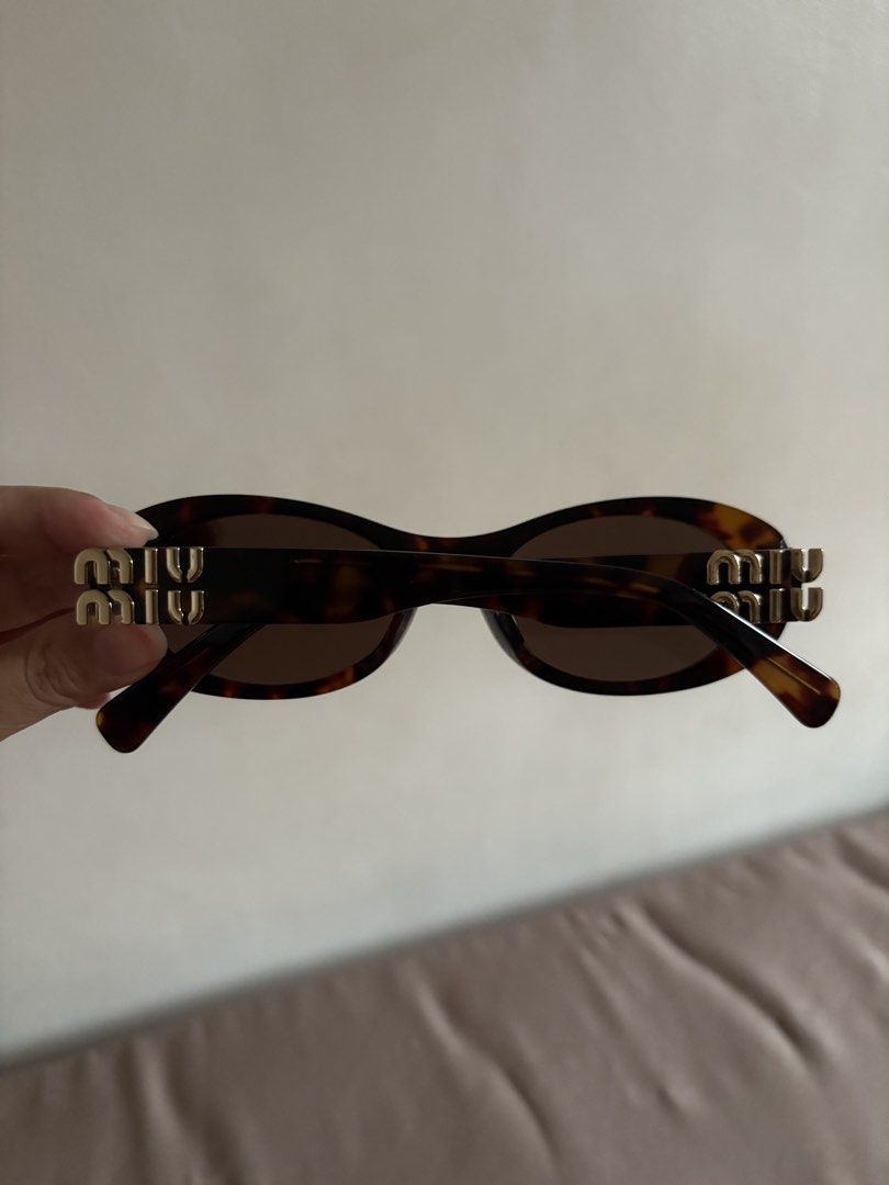 Miu Glimpse Sunglasses (Category: Luxury Accessories) located in Marilao. Submitted by lovely.loot (Listing ID 1456493717, Image 3). Description: Authentic Miu Miu Glimpse Sunglasses SMU09W Honey Tortoiseshell/Coffee. Barely used, no scratches. No original case included. .