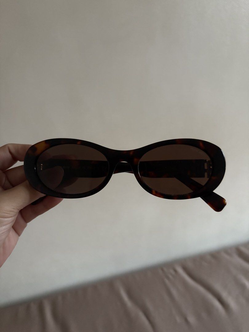 Miu Glimpse Sunglasses (Category: Luxury Accessories) located in Marilao. Submitted by lovely.loot (Listing ID 1456493717, Image 2). Description: Authentic Miu Miu Glimpse Sunglasses SMU09W Honey Tortoiseshell/Coffee. Barely used, no scratches. No original case included. .