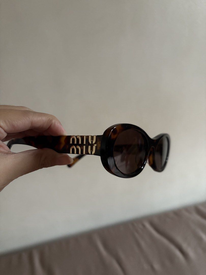 Miu Glimpse Sunglasses (Category: Luxury Accessories) located in Marilao. Submitted by lovely.loot (Listing ID 1456493717, Image 1). Description: Authentic Miu Miu Glimpse Sunglasses SMU09W Honey Tortoiseshell/Coffee. Barely used, no scratches. No original case included. .