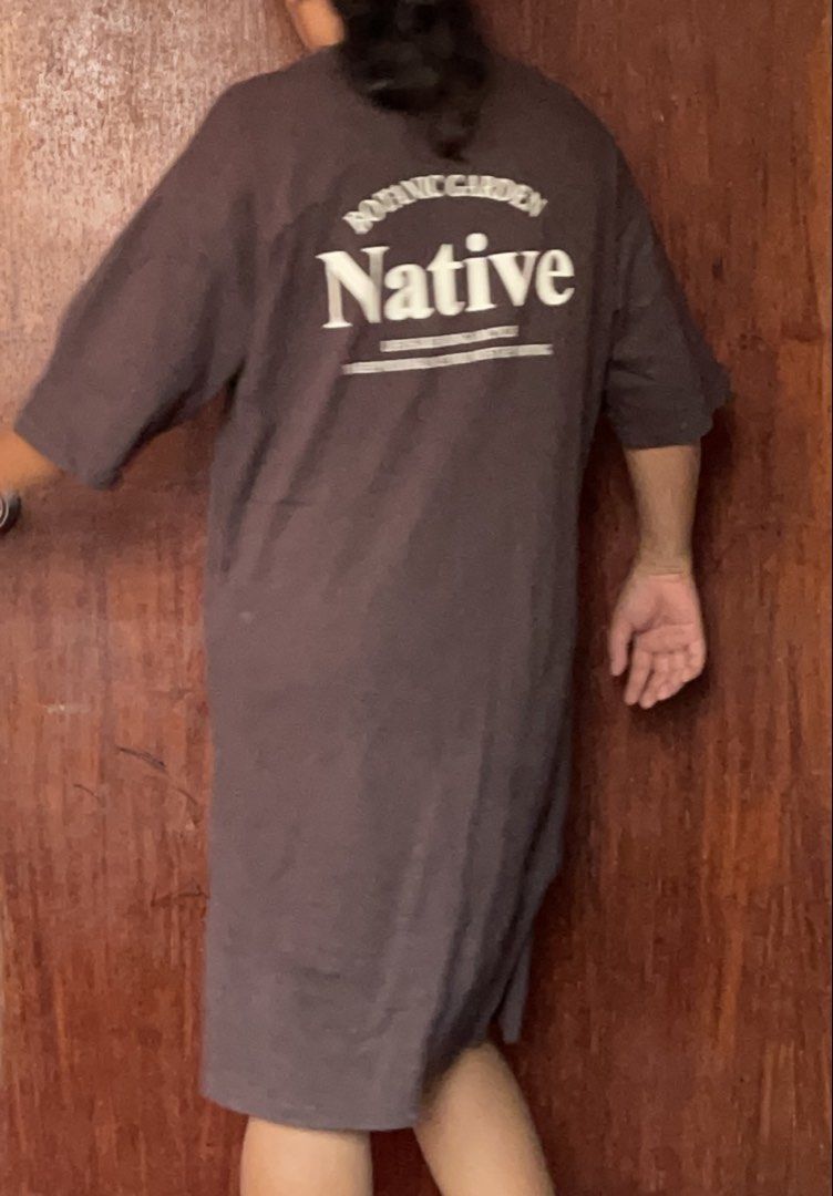 Native Oversized T-Shirt Dress Brown (Category: Dresses) located in Toledo. Submitted by klnmia (Listing ID 1456536911, Image 2). Description: - Brown oversized t-shirt dress - Features 'Native' graphic on front and back - Side slits for easy movement - Comfortable and casual - Ideal for everyday wear.