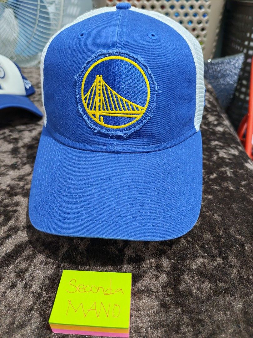 New Era Golden State Warriors Trucker Cap (Category: Caps & Hats) located in Cainta. Submitted by yiegel (Listing ID 1456546583, Image 1). Description: - Blue and white Golden State Warriors trucker cap - Features official team logo on front - New Era 9FORTY model - Adjustable snapback for a comfortable fit - Ideal for any Warriors fan.