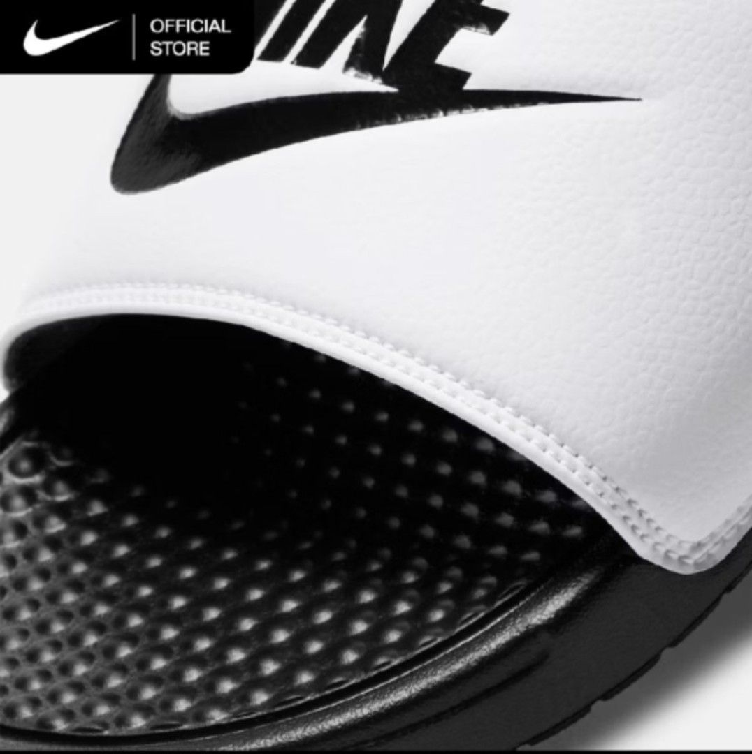 Nike Benassi Just Do It Slides Black White (Category: Slippers & Slides) located in Rizal. Submitted by bonafide.essentials (Listing ID 1456475237, Image 3). Description: - Classic Nike Benassi slide - size 12 - Features iconic Nike swoosh logo - Ideal for casual wear or after sports - Easy slip-on and off design - Durable sole for long-lasting wear.