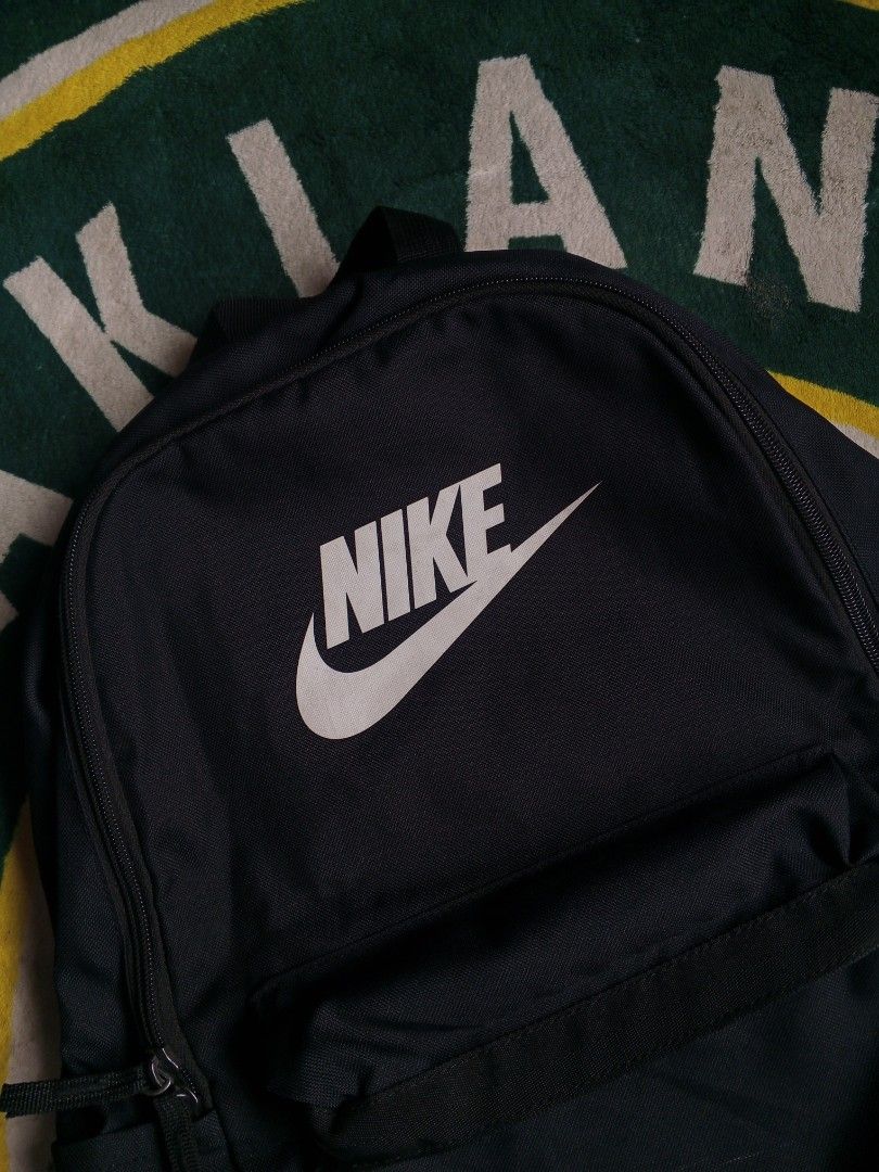 Nike Black Backpack (Category: Backpacks) located in Las Pinas. Submitted by allhandpick (Listing ID 1456534932, Image 2). Description: - Classic black Nike backpack - Simple and functional design - Main compartment with a front pocket - Padded shoulder straps for comfort - Made from 100% polyester - Ideal for school or everyday use.