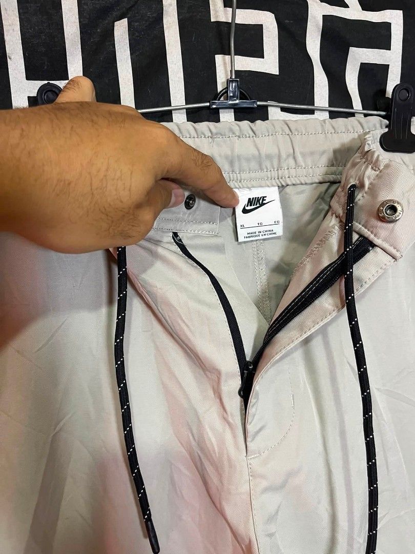 Nike NSW Tech Woven (Category: Activewear) located in Manila. Submitted by bibiiii131998 (Listing ID 1456513283, Image 3). Description: Nike NSW Tech Woven Details W34-36 L38 Xl on tag Issue lastpic sa likod bewang ₱750 Loc.Baclaran Paranaque.