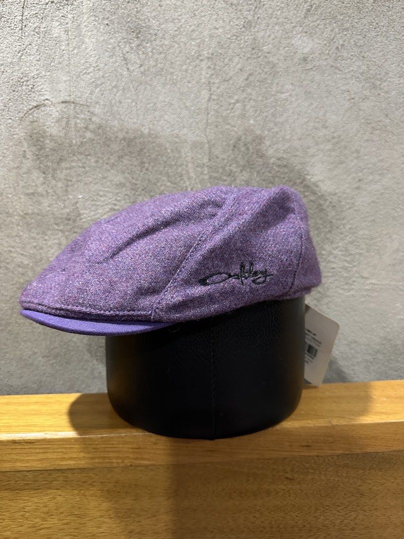 Oakley Purple Tweed Flat Cap Hat (Category: Caps & Hats) located in Mabalacat. Submitted by mrniceguy421 (Listing ID 1456591202, Image 1). Description: - Brand: Oakley - Style: Purple tweed flat cap - Features: Embroidered Oakley logo on the side - Condition: Brand new with original tags attached - Perfect for: Casual wear, adding a stylish accessory to your outfit.