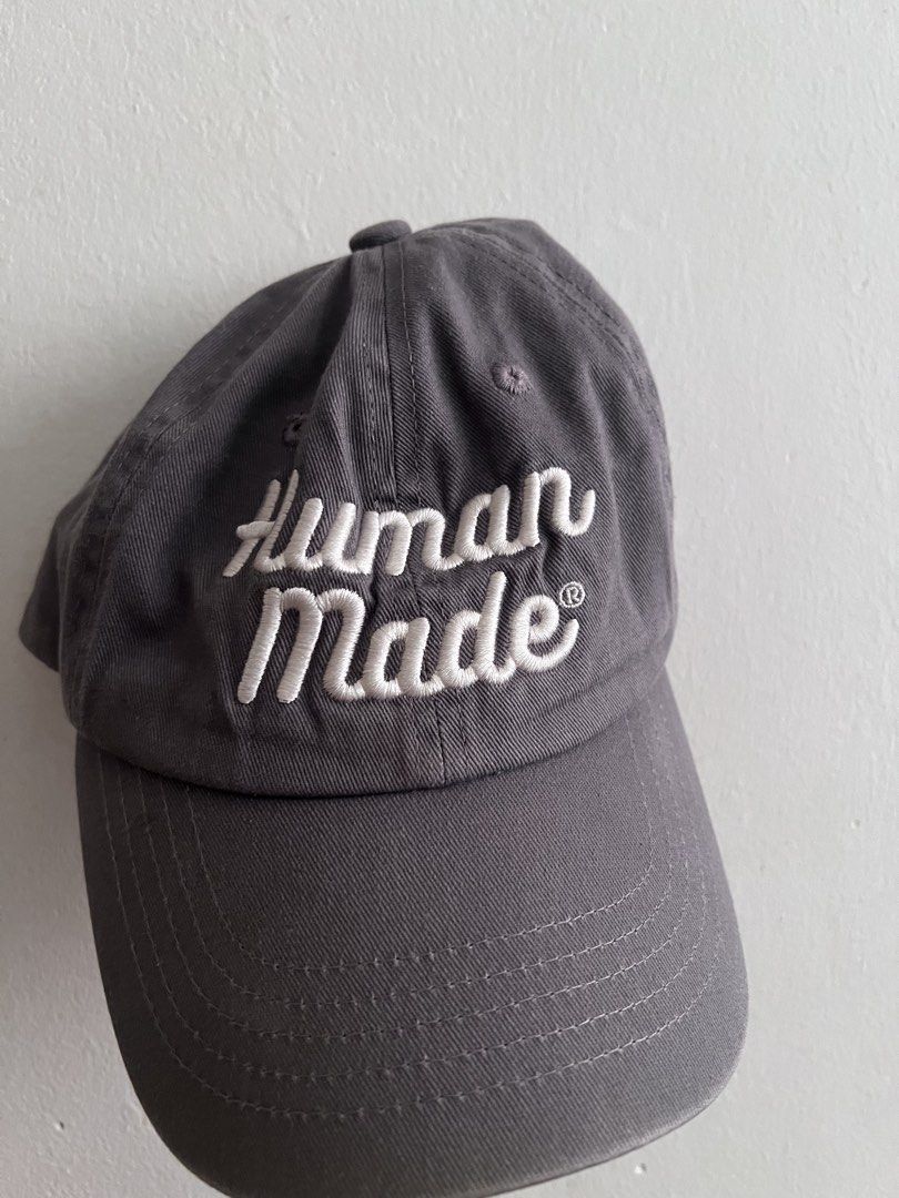 OG Human Made Script Cap (Category: Caps & Hats) located in Singapore. Submitted by innermostt (Listing ID 1456514538, Image 1). Description: OG 2020 Script cap in grey Rare piece Condition overall: 7 / 10 No tear just worn Human made , cap , baseball cap , grey cap.