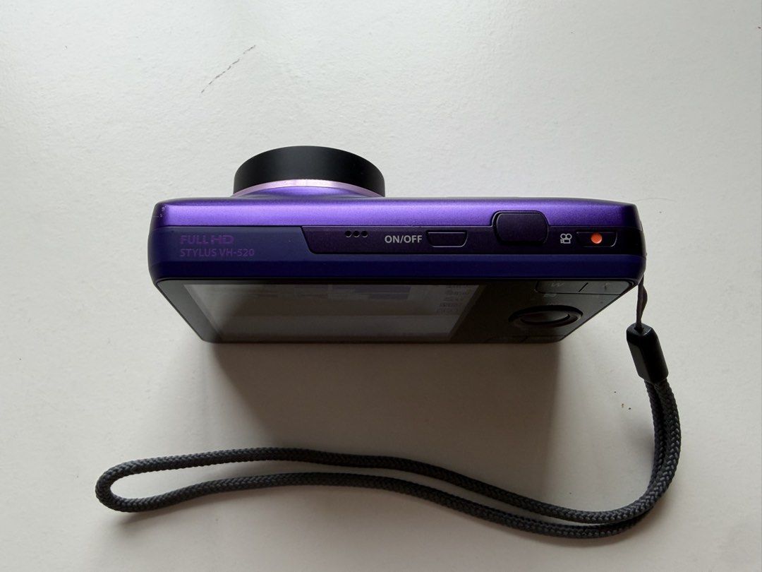 Olympus STYLUS VH-520 Digital Camera – Purple (Category: Cameras) located in Cainta. Submitted by jaaass789 (Listing ID 1456452476, Image 2). Description: Features: • 10x Wide Optical Zoom • Olympus lens • Compact and lightweight • Built-in flash • Video recording • Easy to carry around • Beautiful purple finish.