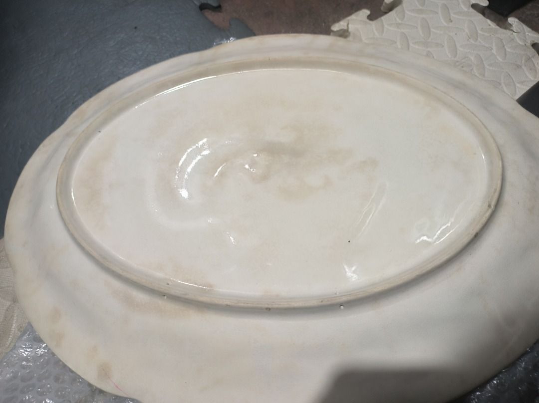 Oval Serving Platter Dish big vintage (Category: Dinnerware & Cutlery) located in Manila. Submitted by leivon (Listing ID 1456534633, Image 2). Description: - White ceramic oval serving platter - Shows some discoloration and marks from use - Ideal for serving food at gatherings - Approximate dimensions: X inches long, Y inches wide.