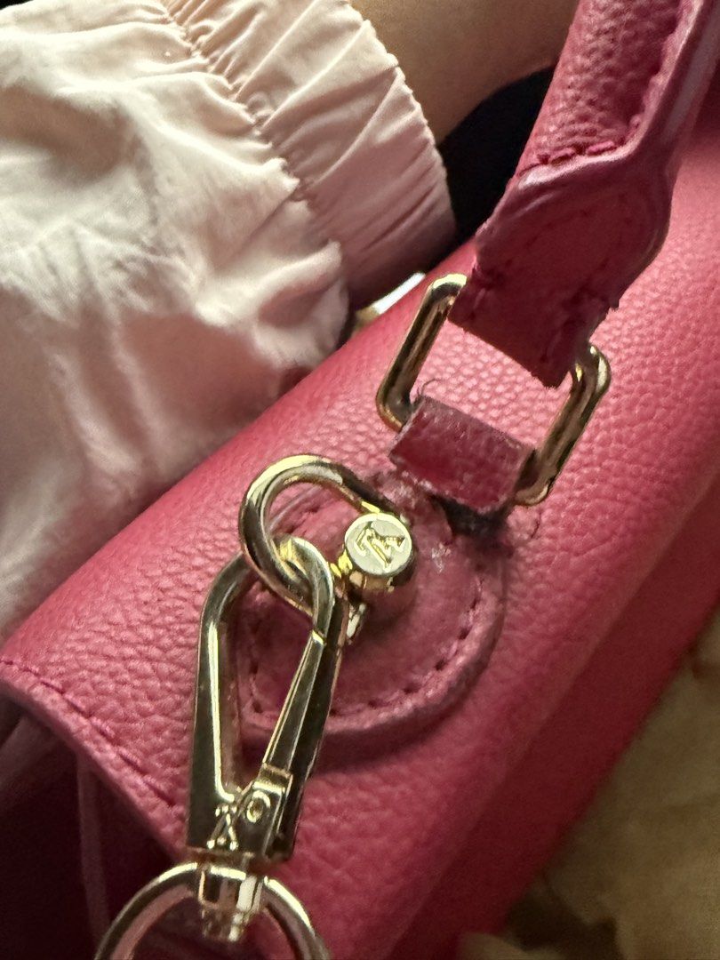 Pink Handbag with Gold Hardware (Category: Luxury Bags & Wallets) located in Manila. Submitted by devorahlop39116 (Listing ID 1436298450, Image 3). Description: - Pink handbag - Gold-tone logo - Top handle - Detachable shoulder strap - Leather material - Flap closure Sign of usage sa handle only.
