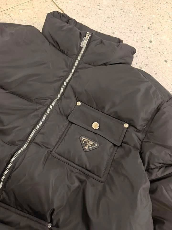 PRADA PUFFER JACKET (Category: Luxury Apparel) located in Baguio. Submitted by lairdegawd_06 (Listing ID 1456570286, Image 2). Description: Dimes: 24x28 Excellent condition 10/10 color rate Complete tags and Searchable Check photos for more details No issue.
