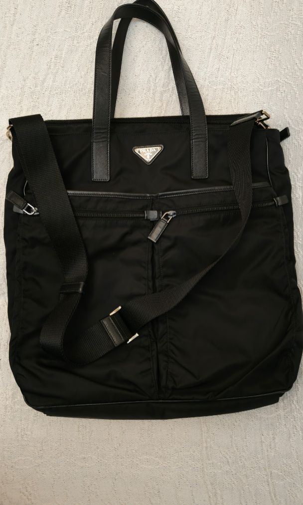 Prada Antic Soft Erica Tote Bag (Category: Luxury Bags & Wallets) located in Makati City. Submitted by emem.pre.owned.ph (Listing ID 1451863591, Image 3). Description: -Authentic Prada Antic Soft Erica Tote/Shoulder Bag -Premium leather handles and trim -Iconic Prada enamel triangle logo -Spacious main compartment with zip closure -Dual front zippered pockets for added organization -Detachable and adjustable shoulder strap -Lightweight, stylish, 