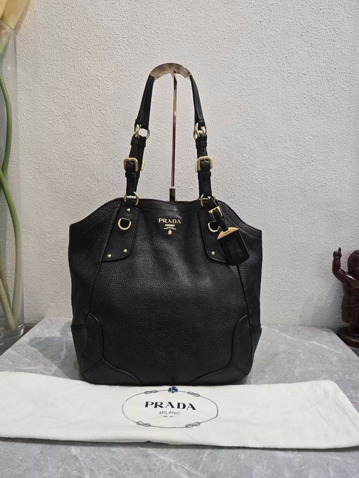 Prada Vitello Daino Shoulder Bag Authentic💯 (Category: Luxury Bags & Wallets) located in Davao. Submitted by preloveditems21davao (Listing ID 1456481612, Image 1). Description: Large size Can fit A4 folder & 14” inches laptop 💻 With Prada dustbag.