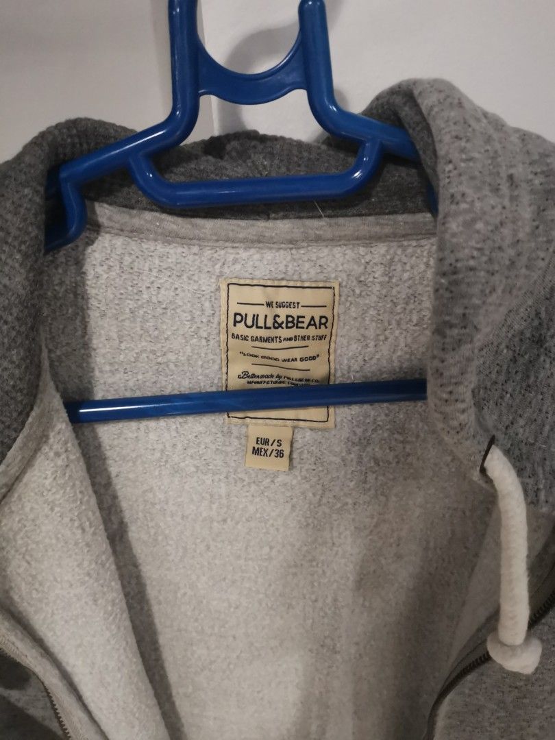 Pull & Bear Grey Zip-Up Hoodie (Category: Hoodies) located in Manila. Submitted by hb1118 (Listing ID 1456576805, Image 2). Description: - Grey zip-up hoodie from Pull & Bear - Size S (EUR/MEX) - Soft and comfortable material - Features pockets and a hood - Zipper in good working condition - Ideal for casual everyday wear.