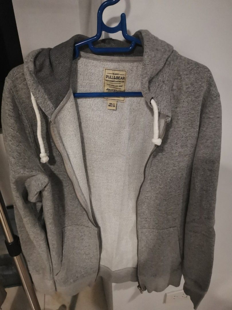 Pull & Bear Grey Zip-Up Hoodie (Category: Hoodies) located in Manila. Submitted by hb1118 (Listing ID 1456576805, Image 1). Description: - Grey zip-up hoodie from Pull & Bear - Size S (EUR/MEX) - Soft and comfortable material - Features pockets and a hood - Zipper in good working condition - Ideal for casual everyday wear.