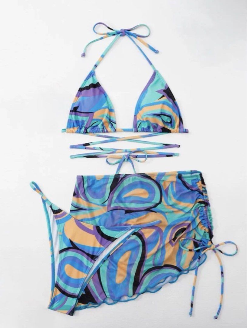 Retro Swirl Print Bikini Set (Category: Bikinis & Swimsuits) located in Tarlac. Submitted by rieselects (Listing ID 1456579710, Image 2). Description: - Funky retro bikini set - Vibrant colorful swirl print - Triangle top with adjustable tie straps - Matching bottoms with a cute skirt overlay - Side ties for a customizable fit - Ideal for beach days or pool parties.
