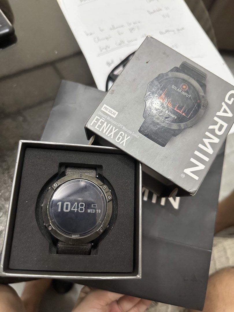 RUSH! Garmin Fenix 6X Pro Solar Titanium Smartwatch (Category: Wearables & Smart Watches) located in San Juan City. Submitted by unclutterermnl (Listing ID 1454090263, Image 1). Description: - Garmin Fenix 6X Pro Solar - Durable Titanium Casing with Power Glass - Water Resistant up to 100 meters - Includes Grey Nylon Strap - Ideal for Outdoor Activities & Everyday Wear - Displays Time and Date -with original box.