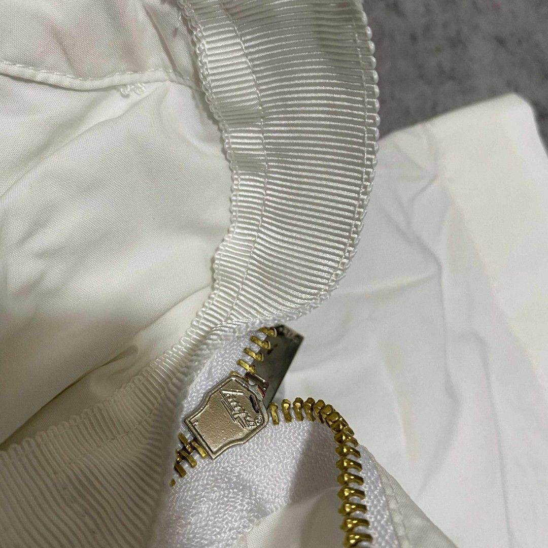 Sacai Shoulder Zip Shirt (Category: Luxury Apparel) located in Abucay. Submitted by esangbalakalang (Listing ID 1456542856, Image 3). Description: Description: - Unique shoulder zip detail - Size 2 - Comfortable cotton and polyester blend - Stylish chest pocket - Side slits with a layered hem for a modern silhouette.