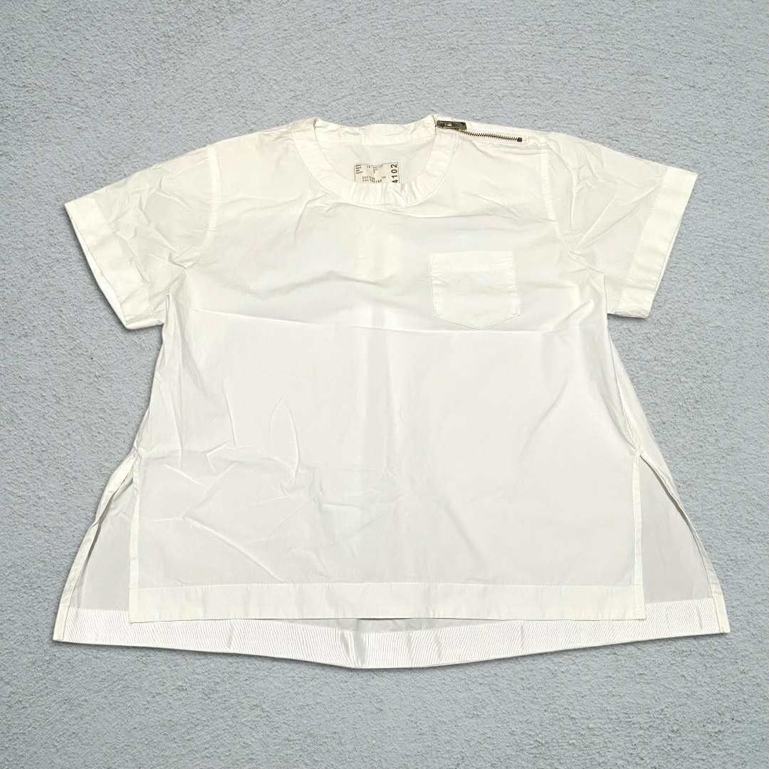 Sacai Shoulder Zip Shirt (Category: Luxury Apparel) located in Abucay. Submitted by esangbalakalang (Listing ID 1456542856, Image 1). Description: Description: - Unique shoulder zip detail - Size 2 - Comfortable cotton and polyester blend - Stylish chest pocket - Side slits with a layered hem for a modern silhouette.