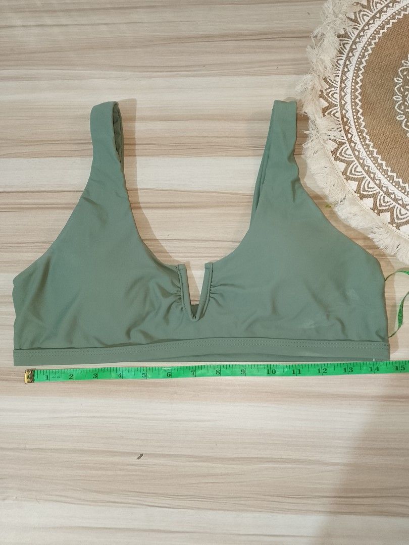 Sage Green V-Neck Bikini Top Size L (Category: Bikinis & Swimsuits) located in Manila. Submitted by truecrystal-1407 (Listing ID 1456594929, Image 1). Description: - Sage green bikini top padded - V-neck design with ruched detail - Material: Polyamide and Elastane - Size: L - Perfect for beach days and pool parties - Comfortable and stylish.