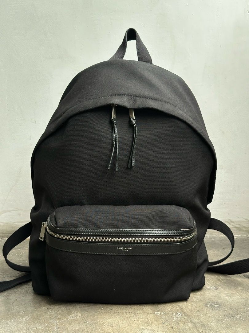 Saint Laurent Paris - 2022 - City Backpack (Category: Backpacks) located in Manila. Submitted by graymatter_ (Listing ID 1456517092, Image 2). Description: Saint Laurent Paris - 2022 - City Backpack Condition: Rank AB Flaws: Minor Chipping of Leather Trims Material: Canvas Made in: Italy Dimensions Height: 45cm Width: 31cm Depth: 15cm.