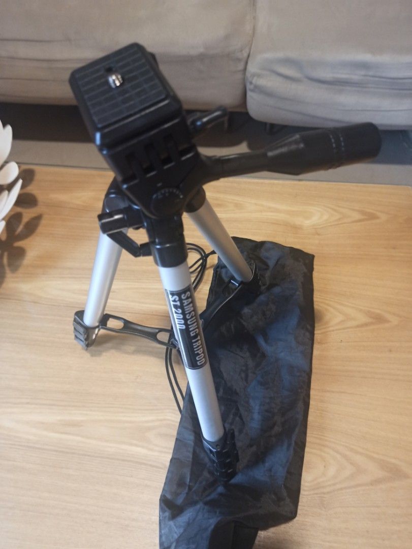 Samsung ST2000 Tripod with Bag - Slim and handy (Category: Tripods & Monopods) located in Caloocan City. Submitted by rtarellano (Listing ID 1456495312, Image 3). Description: - Samsung ST2000 Tripod - Color: Silver and Black - Includes black carrying bag - Built-in bubble level for precise setup - Extendable legs for adjustable height - Maximum extended height: Approximately 45 inches - Ideal for photography and videography.
