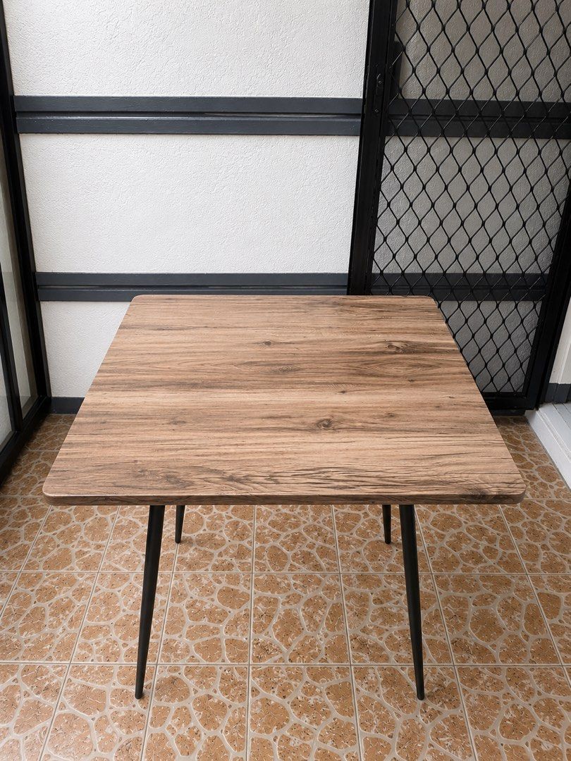 San-Yang Dining Table (Category: Tables & Sets) located in Marikina City. Submitted by impulsivebuyershop (Listing ID 1456446284, Image 3). Description: San-Yang Dining Table Only Made of MDF with PVC finish and a metal frame. Table Size: 70 × 70 × 76 cm (L × W × H) Original Set Price: ₱2,853 Selling Price: ₱1,800 Table only — chairs are not included. ✨ Easy to Clean ✨ Stylish and Multifunctional ✨ Affordable Price Make every meal more enjoyable 