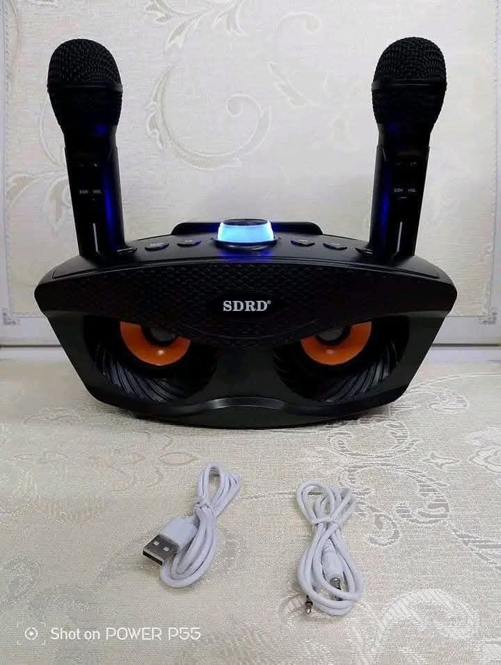 SDRD SD-306 Bluetooth Speaker with 2 Wireless Rechargeable Mics (Category: Soundbars, Speakers & Amplifiers) located in Manila. Submitted by chaionlineshop (Listing ID 1456501475, Image 2). Description: - Portable Karaoke Machine - Connects via Bluetooth, USB, or AUX - Includes 2 Wireless Rechargeable Microphones - Ideal for Parties & Singing Along - Available in Multiple Colors - Easy to Use & Fun for Everyone.